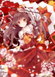  arm_up ascot bow brown_hair collarbone commentary_request detached_sleeves female flat_chest flower gohei hair_tubes hairbow hakurei_reimu highres holding long_hair midriff midriff_peek navel petals photoshop_(medium) red_bow red_eyes sakura_ran smile solo touhou wind 